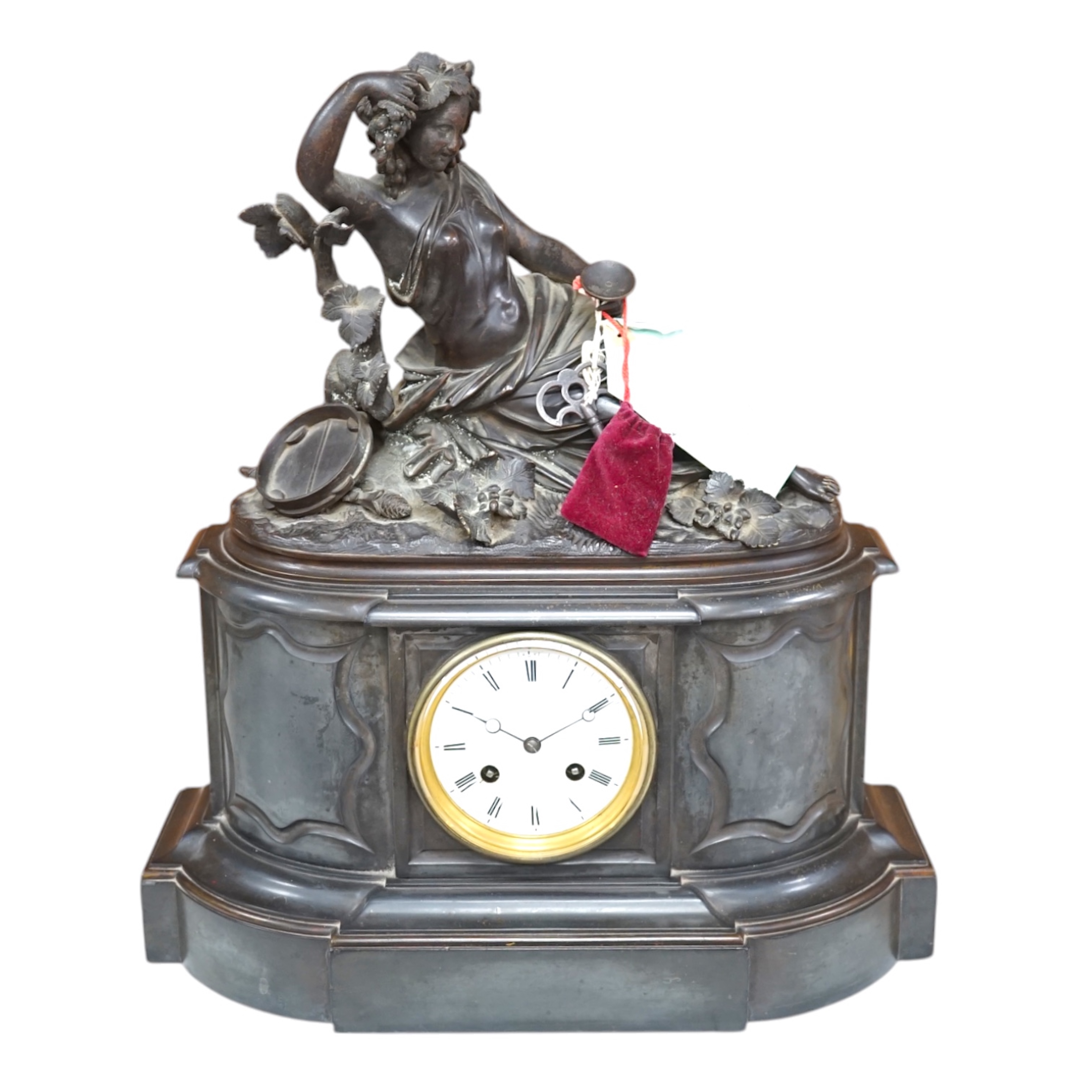 A Victorian black marble eight day mantel clock, surmounted by a cast bronze figure of a muse, with key, 48cm high. Condition - fair, untested